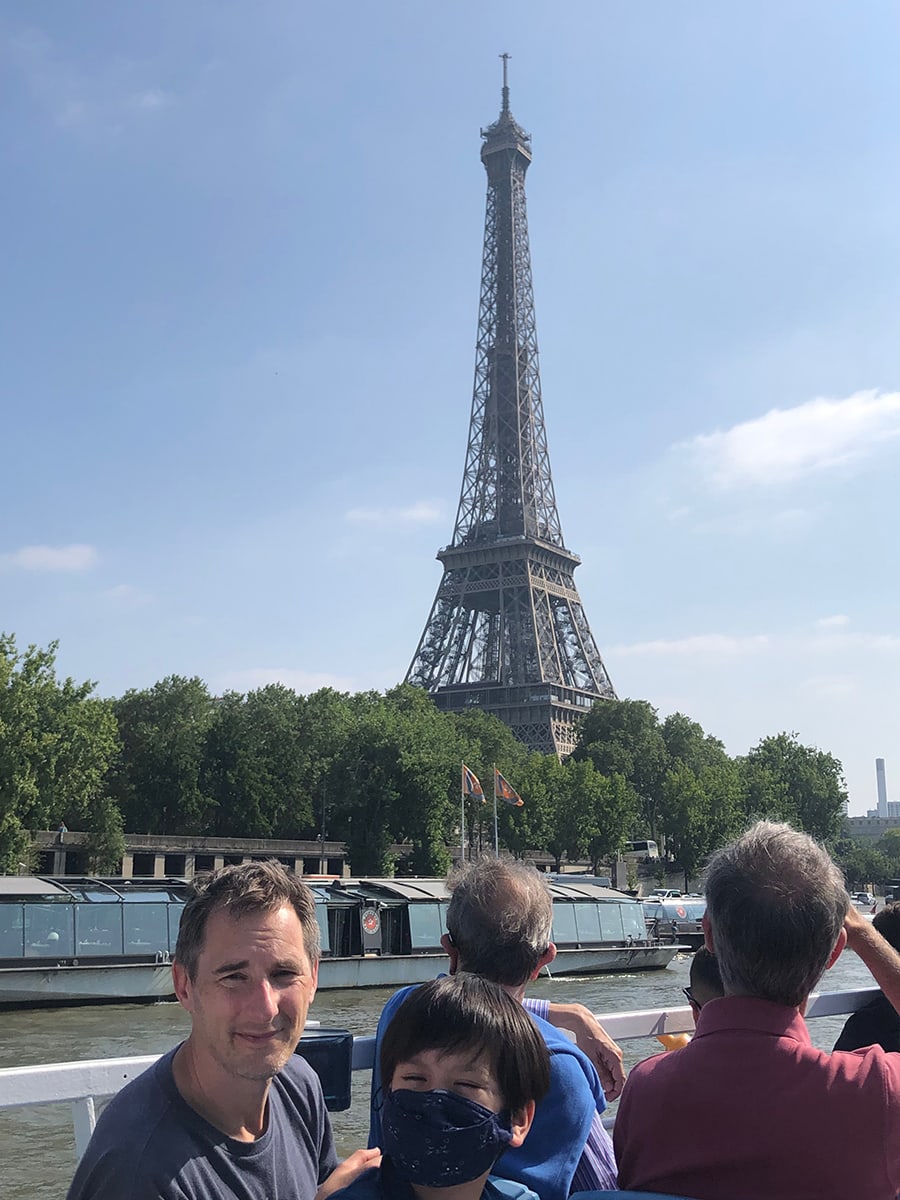 dad and his son in front of Eiffel Tower in Paris, France
